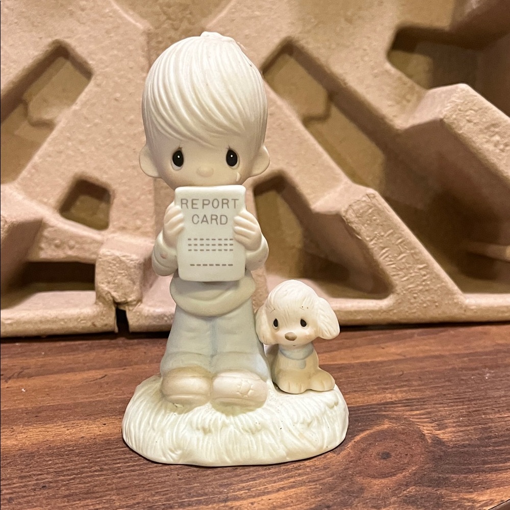 Porcelain Figurine with Report Card and Puppy